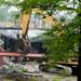An excavator removes a beam from the old Georgetown Mall as it is demolished on Tuesday, May 28, 2013. Melanie Maxwell | AnnArbor.com